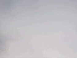 AERIAL WS POV View of clouds and grass field on snow mountains / Montana, United States Stock Footage