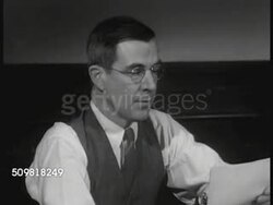 1944: THE TIMES: EXT The Times Dispatch offices. Virginius Dabney (1901-1995) at desk. CU Dabney reading editorial to coworker, '...advocates employment of Colored police...teachers all races equal pay...end racial segregation for street cars.' Instructional Video