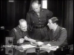1942: LONDON, ENGLAND: FREE FRENCH HEADQUARTERS: HA WS General Charles de Gaulle's headquarters. Officers talking w/ General Charles de Gaulle at desk. CU Charles de Gaulle. World War II, WWII. Instructional Video