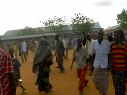 Refugees following UN officer Stock Footage