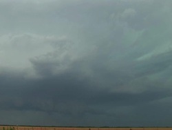 WS View of green supercell thunderstorm and wall cloud with lightning in day over prairie / Texas, United States Stock Footage