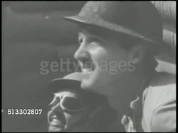 1942: BATTLE OF MIDWAY: VS United States Army & Marines on Midway Island air base firing anti-aircraft machine guns, Japanese bombers flying overhead, Japanese dive bomber crashing. World War II, WWII, Pacific Front Instructional Video