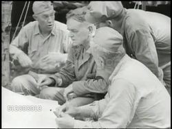 1943: BOUGAINVILLE CAMPAIGN:  VS U.S. Navy Fleet Admiral William 'Bull' Halsey Jr. (1882-1959) sitting at camp meeting w/ General Roy Geiger (1885-1947) &amp; officers. WWII, World War II, Pacific Front Instructional Video