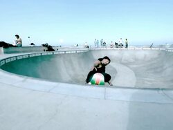 WS SLO MO Shot of skateboarder doing aerial tricks in skate park bowl / Venice, California, United States Stock Footage