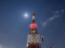 telecommunication Tower Cloudscape at night with star and moon moving Stock Footage