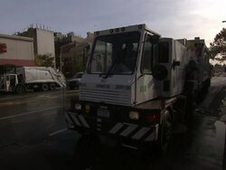 A taxi passes a sweeper truck on a marathon route in New York City. Stock Footage