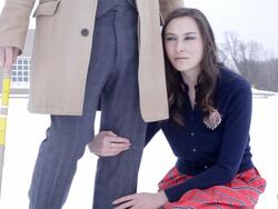 MS Young woman resting on her husbands leg while playing croquet outside in snow during winter / Minneapolis, Minnesota, United States Stock Footage