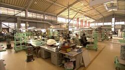 Ceramics factory workers paint pottery in Arita, Japan. Stock Footage