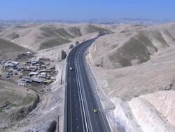 Aerial Highway 1 connecting Jerusalem and the West Bank until the Beit HaArava Junction with Route 90 south of Jericho near the shores of the Dead Sea., Northern Judea Desert Stock Footage
