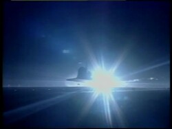 Silhouette of Space Shuttle Discovery landing at night Stock Footage