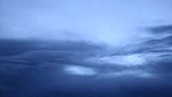 aerial shots below the clouds at dusk Stock Footage