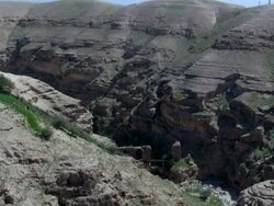  WS AERIAL PAN View of  wadi desert / Qumran,  Norrn Judea Desert, Israel Stock Footage