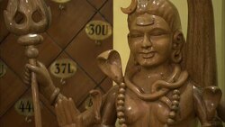 Shadows fall across a carved goddess. Stock Footage