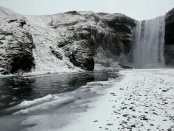 MS Shot of Water and icy snow coming down river at snowing condition / Iceland  Stock Footage