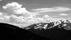 Aspen Colorado Black and white Time-lapse Clouds building over Aspen Highlands Snow Capped Peaks and Deep Elk Mountain Valley Stock Footage