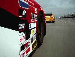 LA TS CU Racecar wheel driving on racetrack behind another car / Long Pond, Pennsylvania, USA Stock Footage