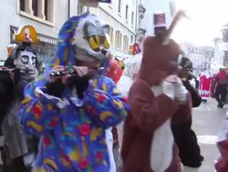 MS Shot of masked people walking on street and celebrating in Basel Carnival (Basler Fasnacht) / Basel, Switzerland Stock Footage