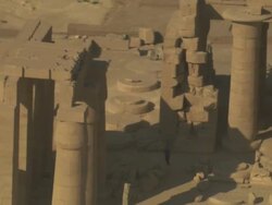 High Angle, aerial zoom-out - Sandstone historical ruins with large pillars stand out in the Egyptian Nile Delta Stock Footage