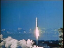 1960s wide shot missile blasting off into blue sky / Cold War / documentary Stock Footage