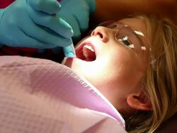 MS Young girl sitting in dentist chair / Lamy, New Mexico, United States Stock Footage