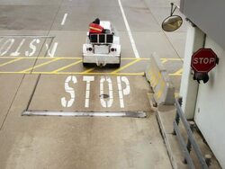 Airport workers on motorized vehicles Stock Footage