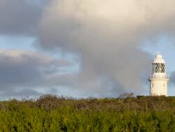 Lighthouse with cloudy sky in background / Western Australia, Western Australia, Australia Stock Footage
