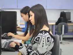 Female Student Works on Computer in Classroom Stock Footage
