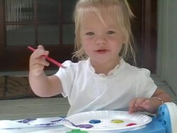 Little girl paints a picture. Stock Footage