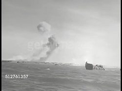 1943: OFF COAST OF BETIO, TARAWA: WS Higgins Landing Craft in water w/ island BG. VS US Marine soldiers in Higgins boats. WS Higgins Landing Craft boats on water.  World War II, WWII. Instructional Video