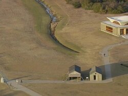 MS AERIAL ZO Shot of people walking near Kitty Hawk Wright Brothers Memorial / North Carolina, United States Stock Footage