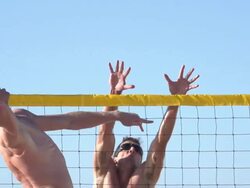 Men playing beach volleyball. - Slow Motion - filmed at 240 fps Stock Footage