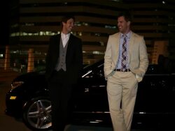 MS TU Two well dressed young man standing together on modern convertible car at night in urban area laughing and smiling / Minneapolis, Minnesota, United States Stock Footage