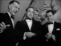 1963 black and white low angle medium shot Marlon Brando cutting ribbon with director George Englund and Tony Randall / Bangkok Stock Footage