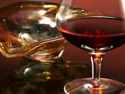 MS R/F Burning cigar being placed in ash tray and wine in brandy snifter glass / Los Angeles, California, United States Stock Footage