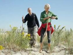 WS TU TD Mature couple hiking and woman talking on mobile phone / Clinton, New Jersey, USA Stock Footage