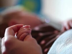 Mother hand and new born baby girl Stock Footage