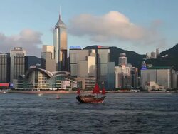 Motor boat with modern Hong Kong Island high rises in background Stock Footage