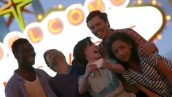 Friends take funny smartphone photos under classic Welcome To Las Vegas sign Stock Footage