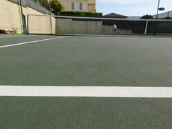 WS PAN DS Dolly shot of a tennis serve fault and the ball hitting the net. Stock Footage