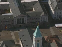 CU AERIAL ZO Shot of castle to people walking on street / Karlsruhe, Baden Wurttemberg, Germany Stock Footage