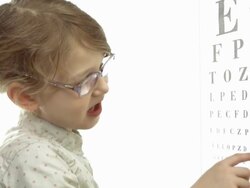 HD: Little Girl Reading Eye Chart Stock Footage