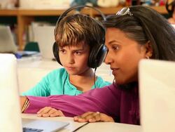 MS Teacher helping student on computer in library / Santa Fe, New Mexico, United States Stock Footage