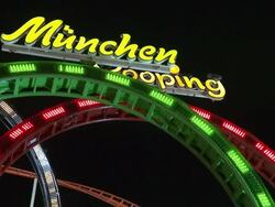 rollercoaster "Olympialooping" at night Stock Footage
