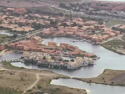 WS AERIAL View of Holiday complex behind Port Barcares (for red roofs) / Languedoc Roussillon, France Stock Footage