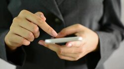 Businesswoman using a smartphone. Stock Footage
