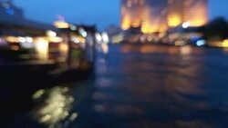 Bokeh of cityscape along river Stock Footage