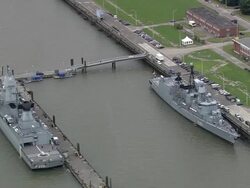 AERIAL Military ships in naval base, Wilhelmshaven, Lower Saxony, Germany Stock Footage