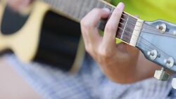 young man Learn to Play Guitar Stock Footage
