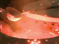CU Smoke and sparks leaping in melting furnace / Langenfeld, North Rhine-Westphalia, Germany Stock Footage