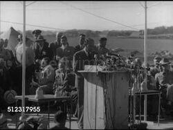 1952: ADLAI STEVENSON II SPEECH:  VS U.S. Democratic presidential candidate Adlai Stevenson II at podium speaking about protecting agricultural workers, people at rally clapping & cheering. Campaign, speech, political rally, politics Instructional Video